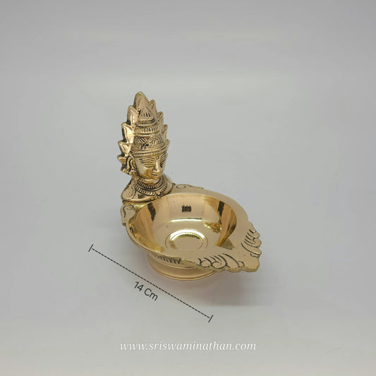 Side view of Amman vilakku showcasing Devi Shakti lamp design and brass work details