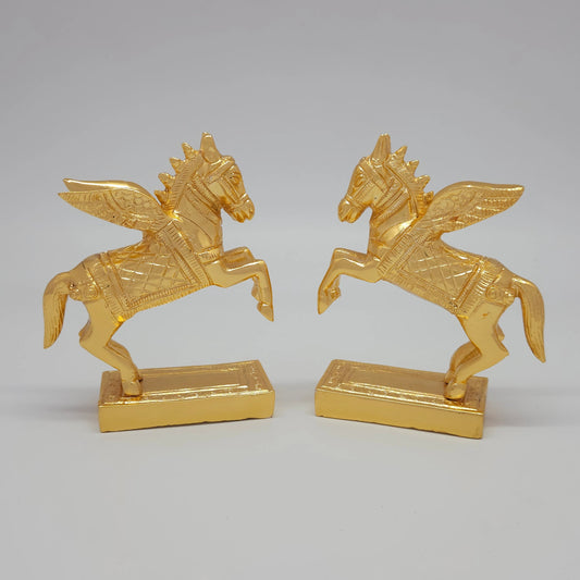 Front angle perspective showing a paired mirror display of the decorative gold finish solid brass winged horse figurines
