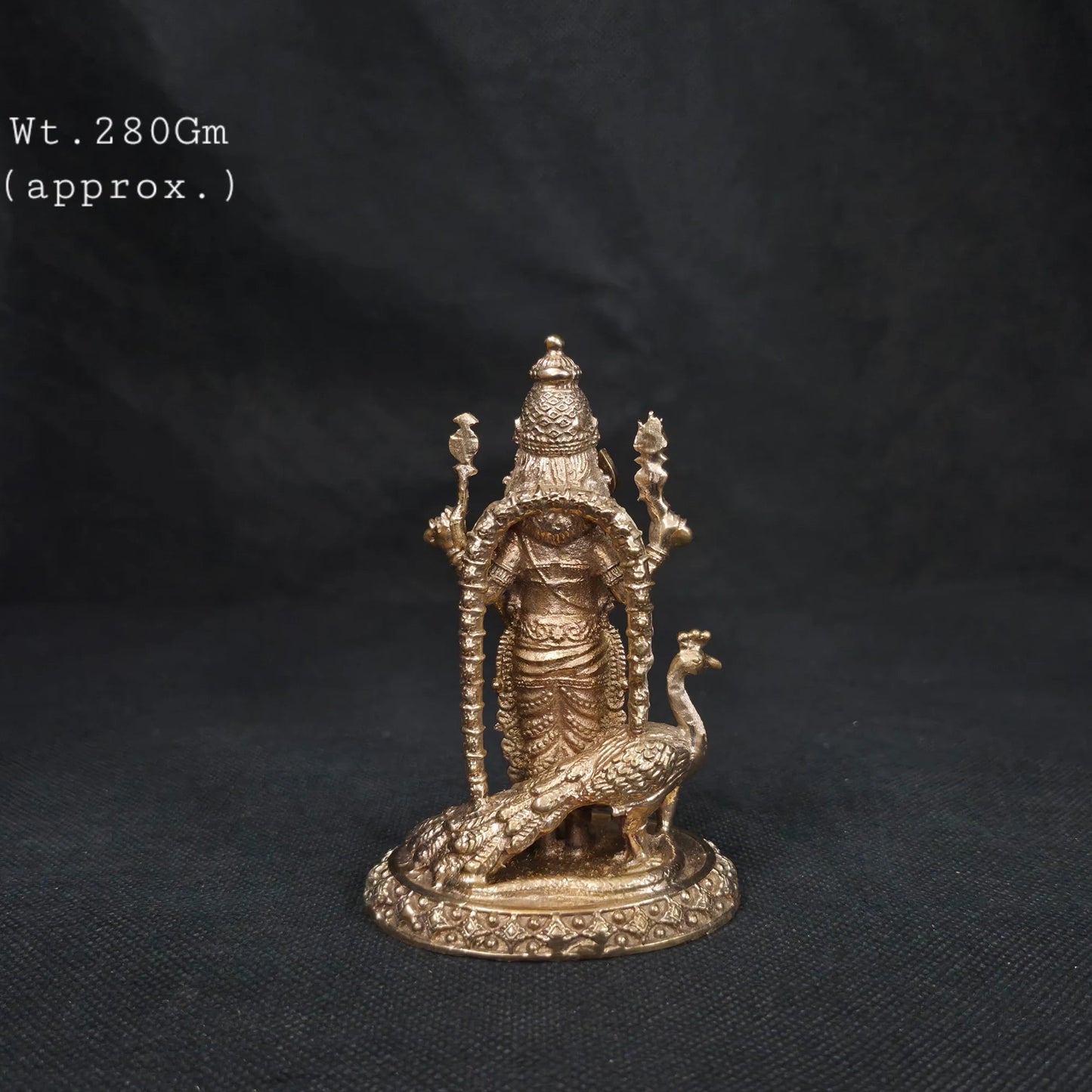 Close-up of Murugan Panchaloha Statue four hands — Vel, Trishul Chaturbhuja form detail, handcrafted in Kumbakonam