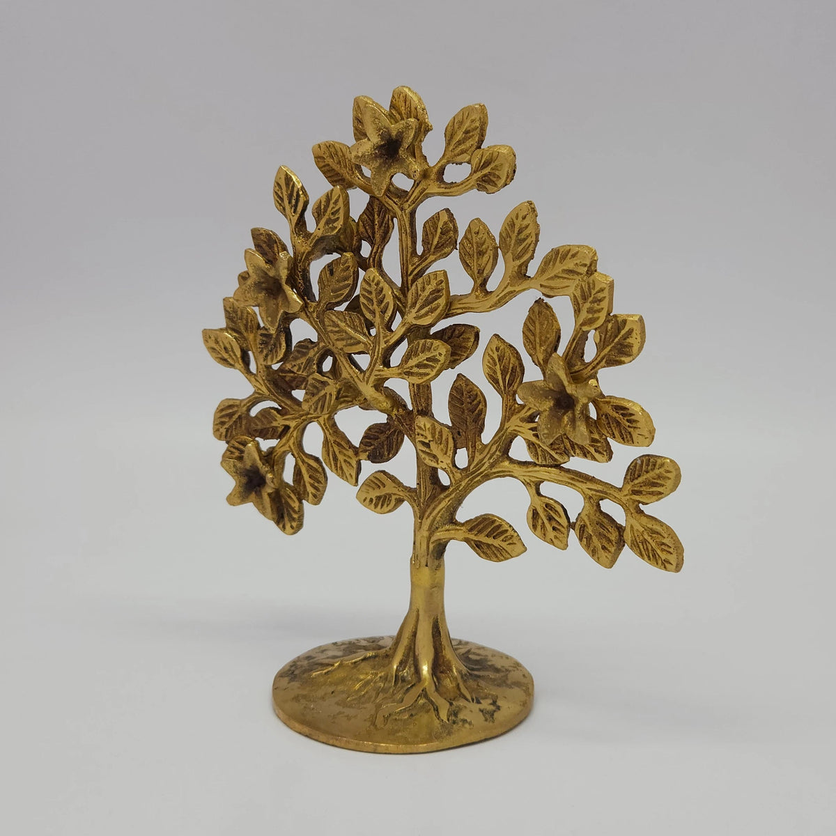 Premium Brass Parijata tree statue 6 inch 16cm height 45 degree right pose corner view highlighting splayed roots and 7cm circular base active altar use