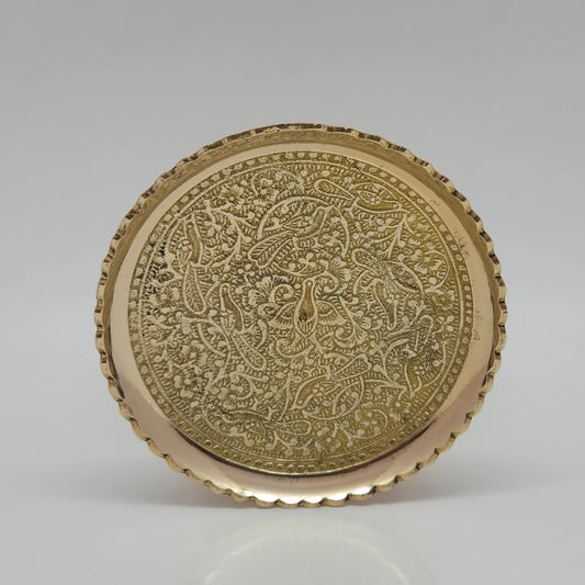 Front view of the smaller pure brass engraved offering plate highlighting the traditional hand-etched nature pattern across the glossy golden center