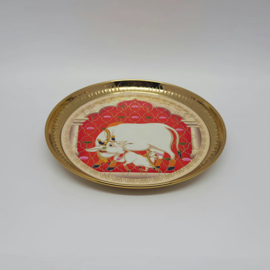 Low angle perspective view of the brass coated pichwai decorative plate showcasing the structural rim height and shallow basin depth