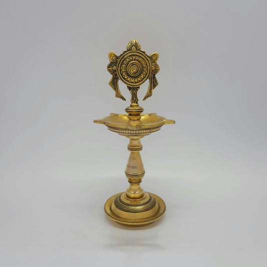 Front presentation view displaying the matching pair of 25cm brass Shanku and Chakra standing kuthu vilakkus side-by-side on a white background.