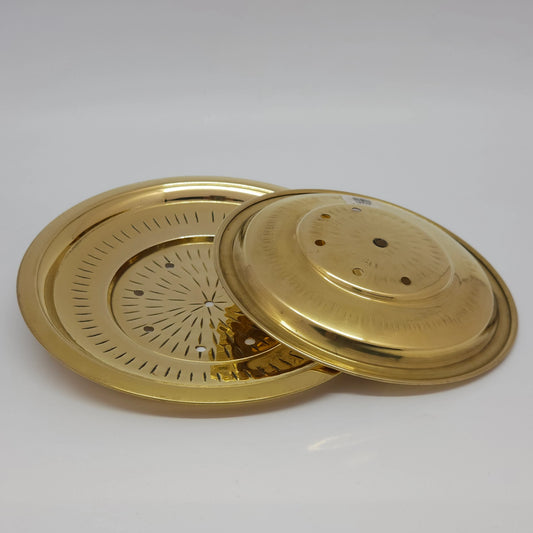 Three-quarter angled perspective view of the fourteen centimeter brass rice strainer lid highlighting the nested stepped rim contours and golden glossy luster.