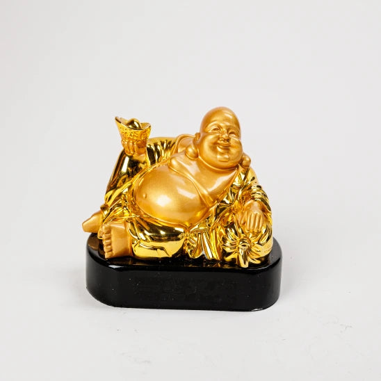 15.5cm premium luxury gold paint finish resin reclining Laughing Buddha statue holding a wealth ingot over a thick rounded black pedestal base by Sri Swaminathan and Co.