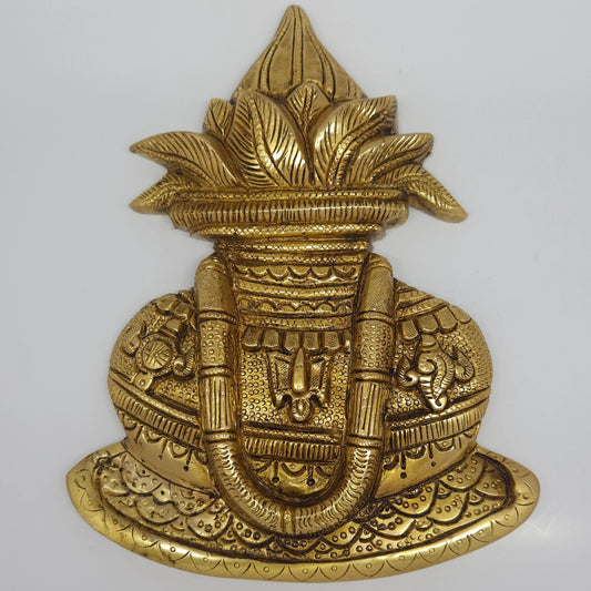 Close up centered front view of the twenty two point five centimeter brass Balaji Kalasam wall hanging panel demonstrating the highly detailed mango leaves and coconut textures.