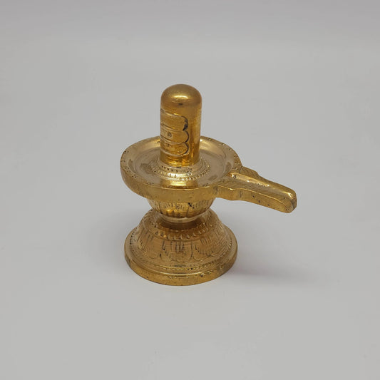 Sri Swaminathan and Co pure brass Shiva Lingam statue 8.5cm height 45 degree left pose corner view highlighting the hand chiseled gomukhi water drainage spout