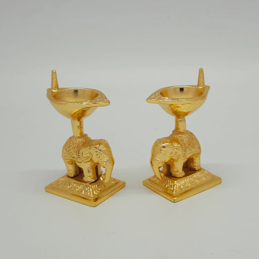 Sri Swaminathan and Co brass elephant diya stand gold powder coated 3 inch 8cm height 45 -egree side pose corner view highlighting single wick channel and elephant saddle pattern
