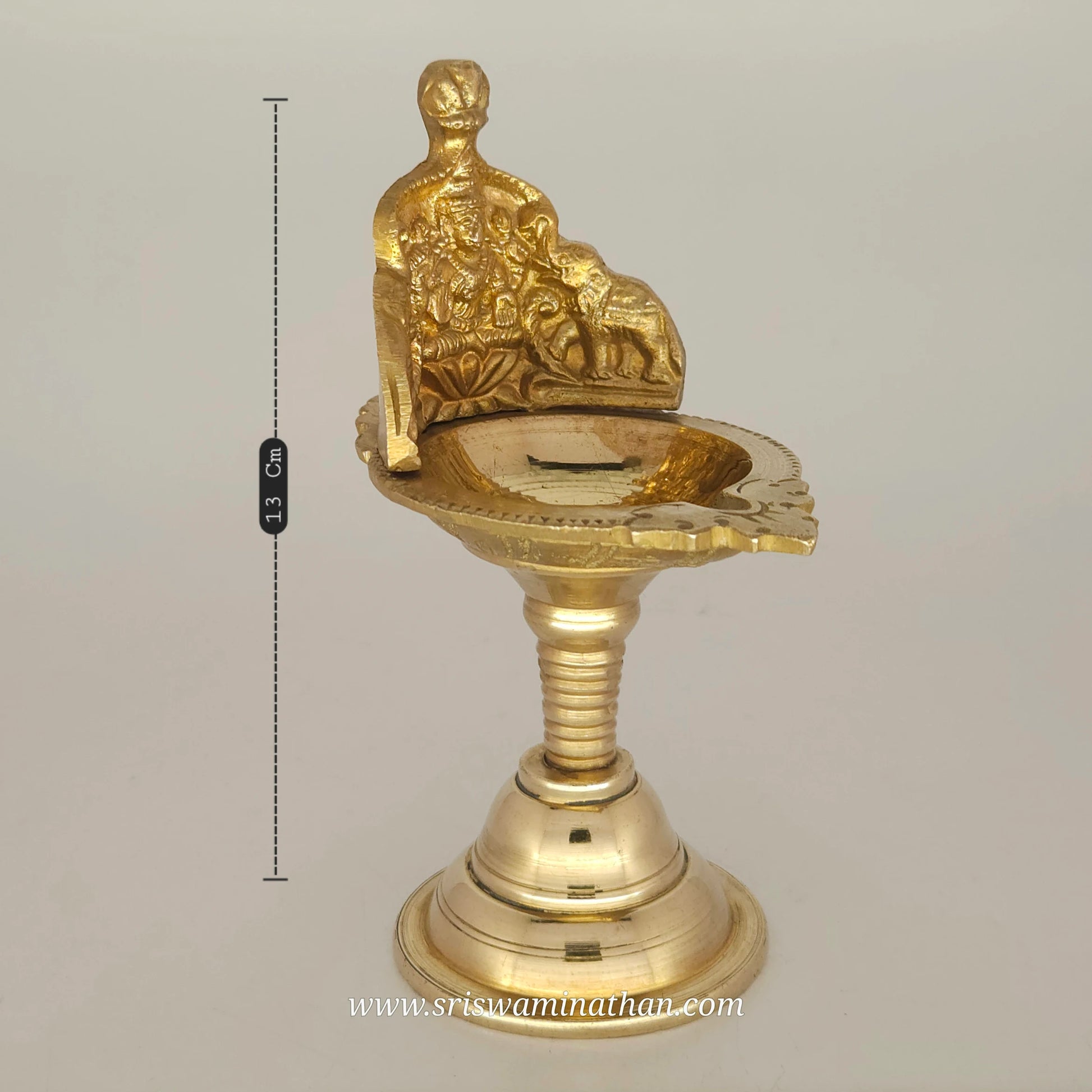 Side view of Gaja Lakshmi vilakku showing traditional Tamil Nadu brass lamp craftsmanship