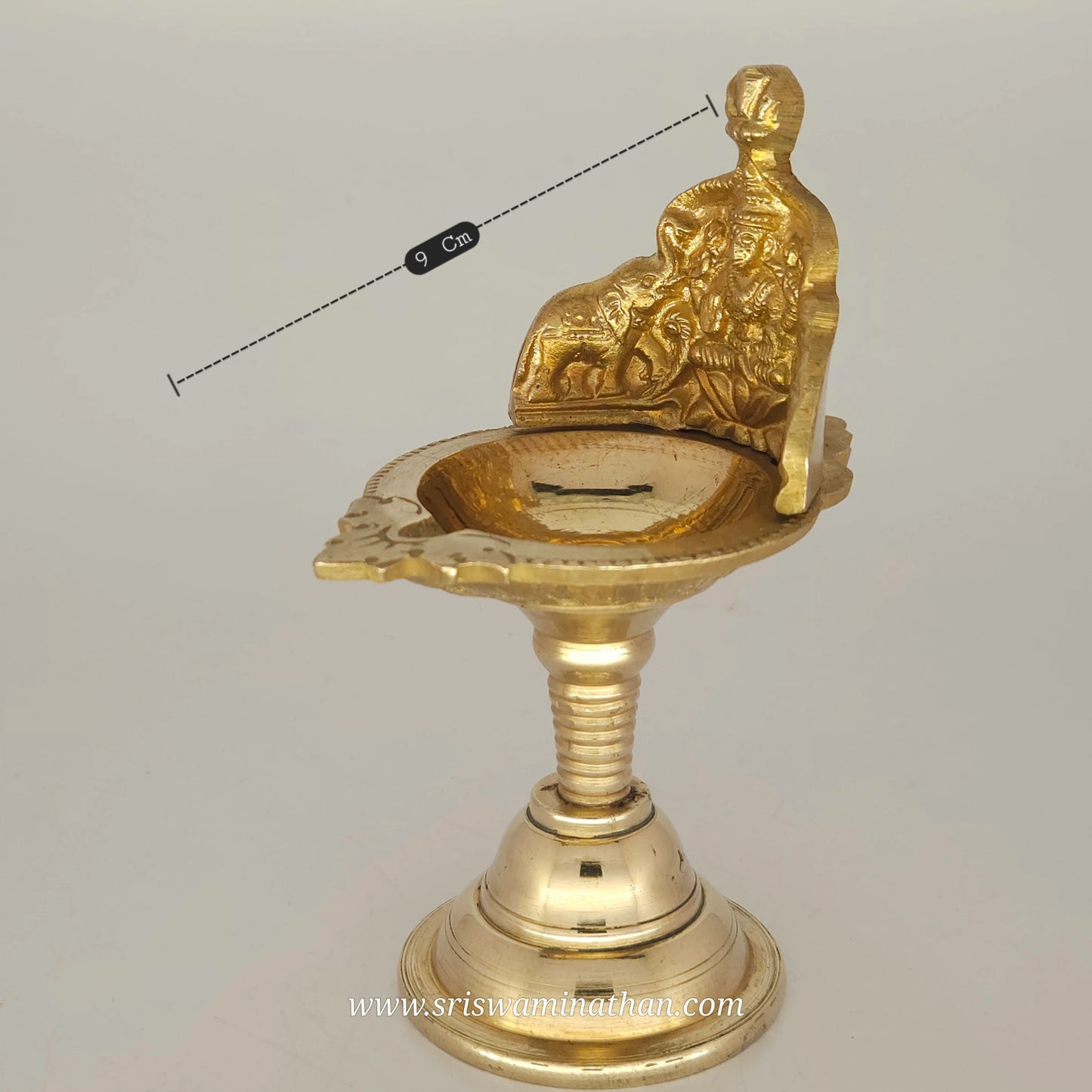 Detailed view of Gaja Lakshmi brass lamp highlighting traditional Tamil Nadu metalwork and design