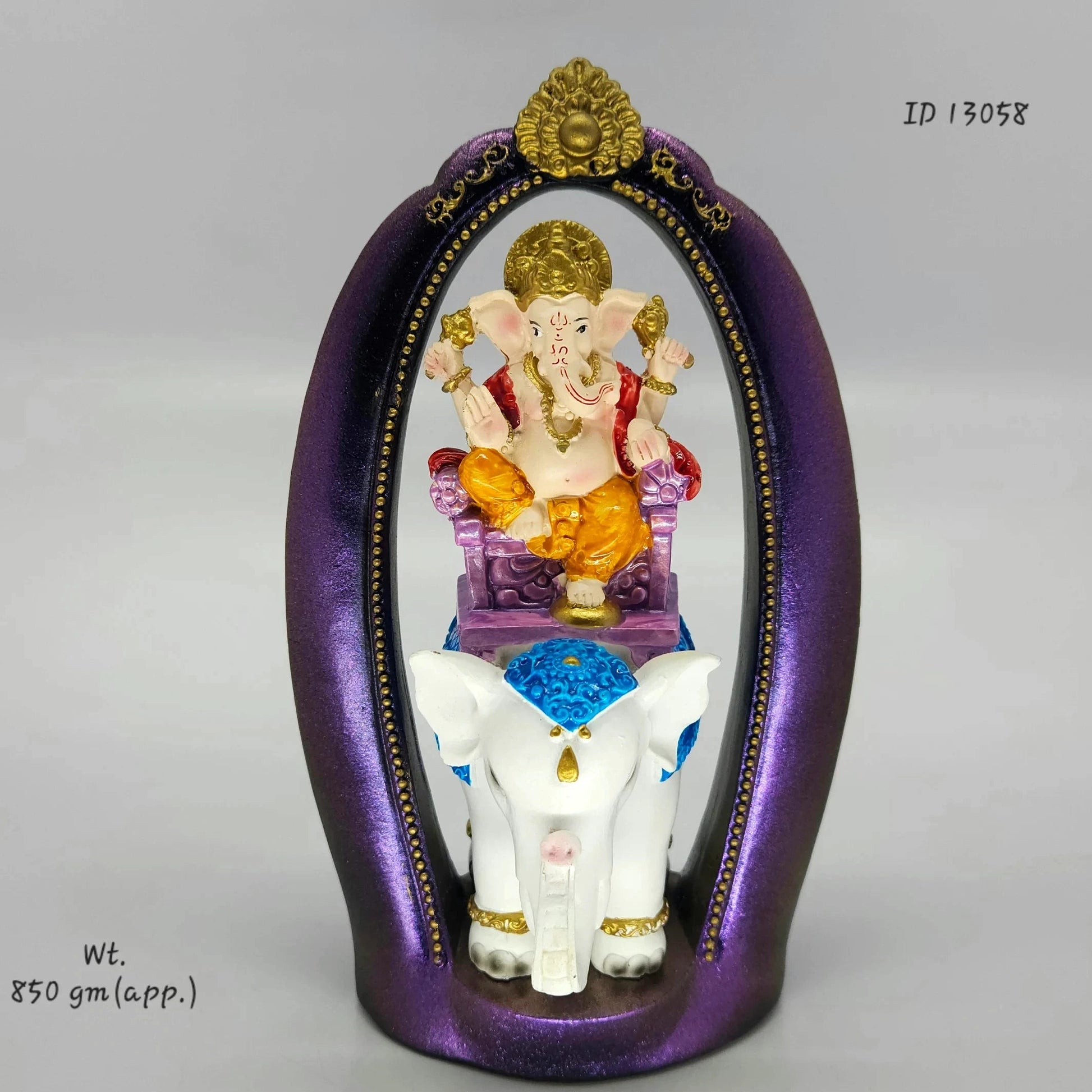 Front view look of the 24 cm premium resin Ganesha idol riding white elephant Airavata fully assembled inside the purple archway
