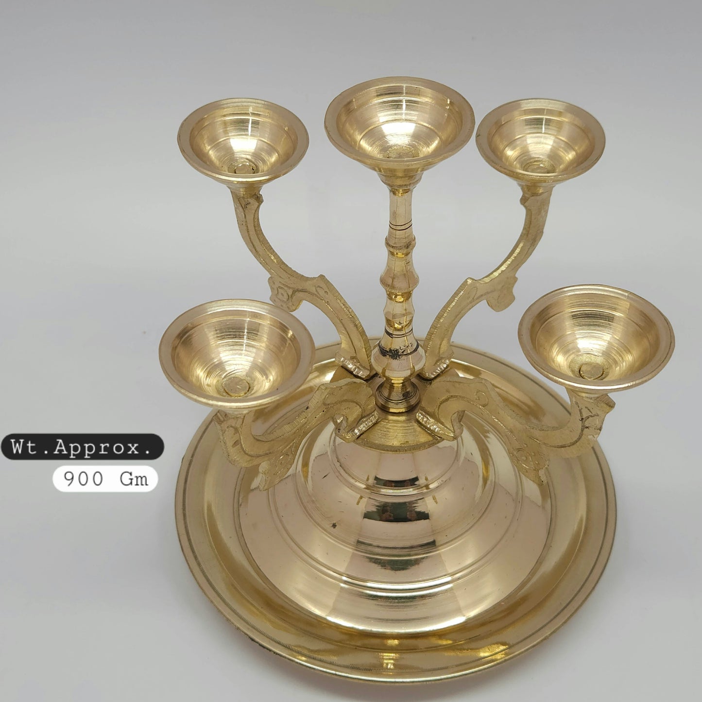 Top down view of the wide 18cm integrated circular disc base tray on the 950 grams heavy duty brass temple deeparadhanai vilakku to prevent oil spills.