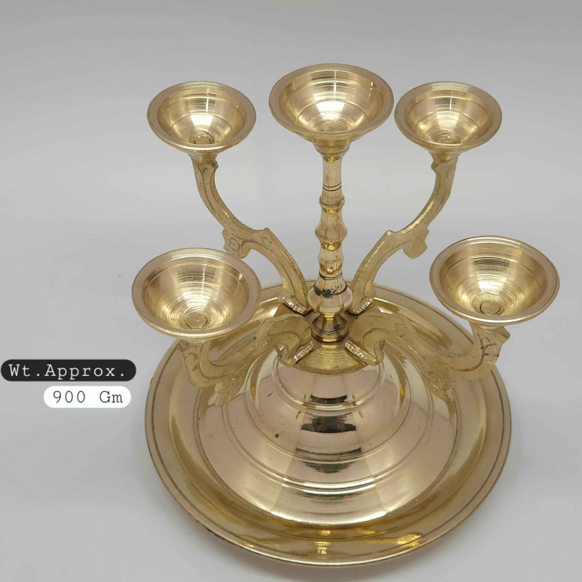 Top down view of the wide 18cm integrated circular disc base tray on the 950 grams heavy duty brass temple deeparadhanai vilakku to prevent oil spills.