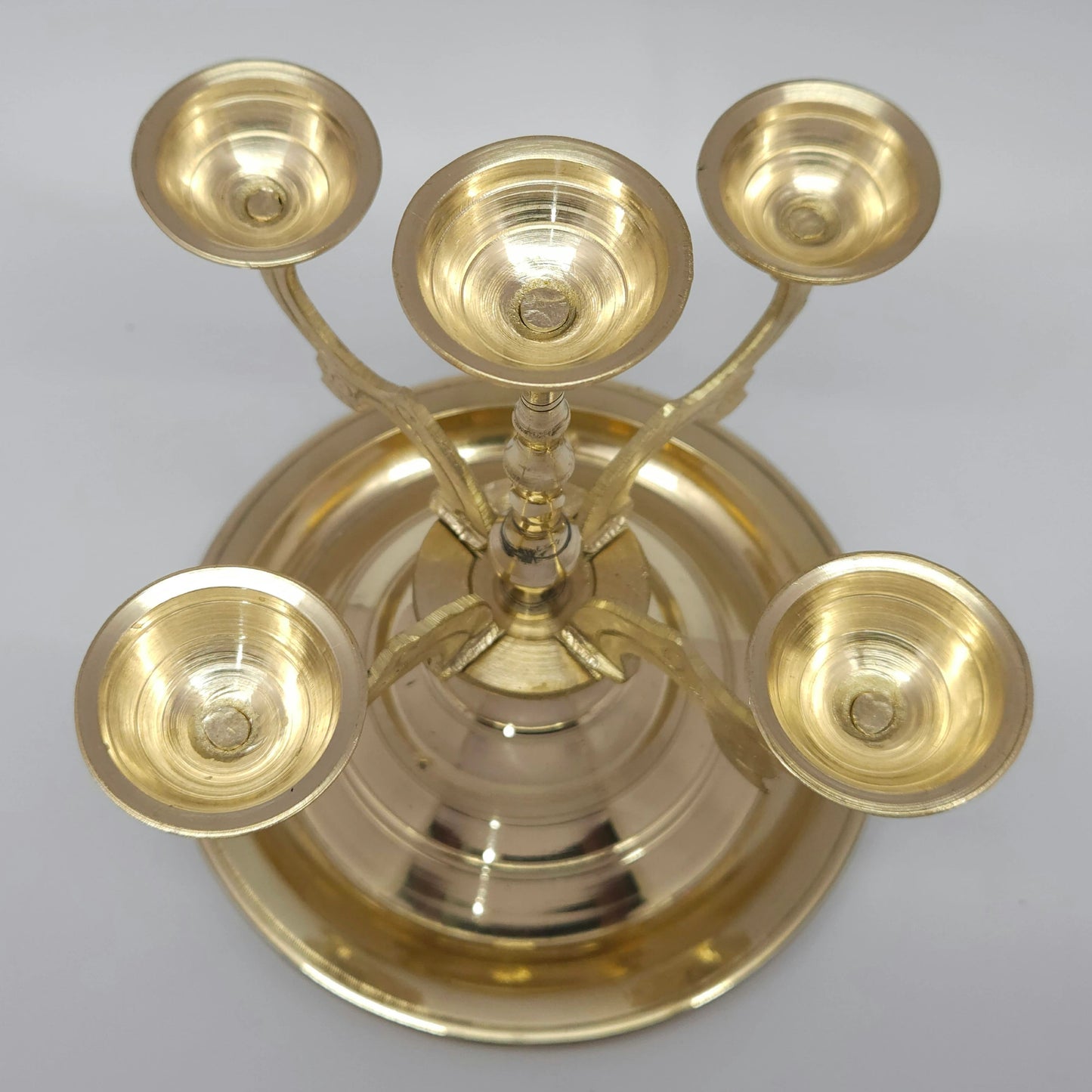Close up detail shot of the five cups on the brass pancha aarti deepam stand, perfect for burning temple soodam, kapoor, or karpooram