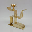 Three quarter angle photo of Sri Swaminathan and Co brass Swastik vilakku highlighting its 15ml oil cup capacity and stable frame design.