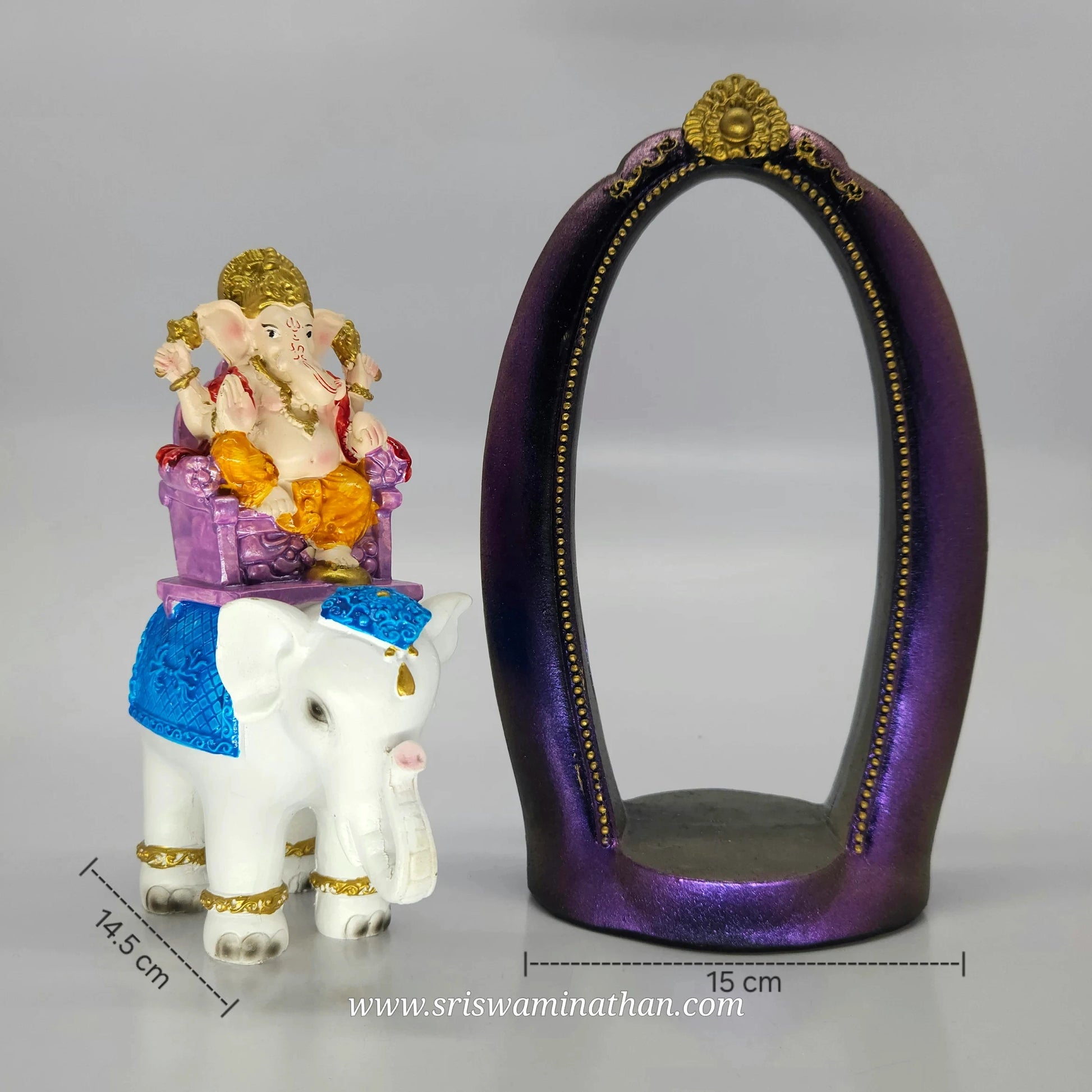 Front angle comparison showing the white elephant piece standing next to the empty purple archway stand