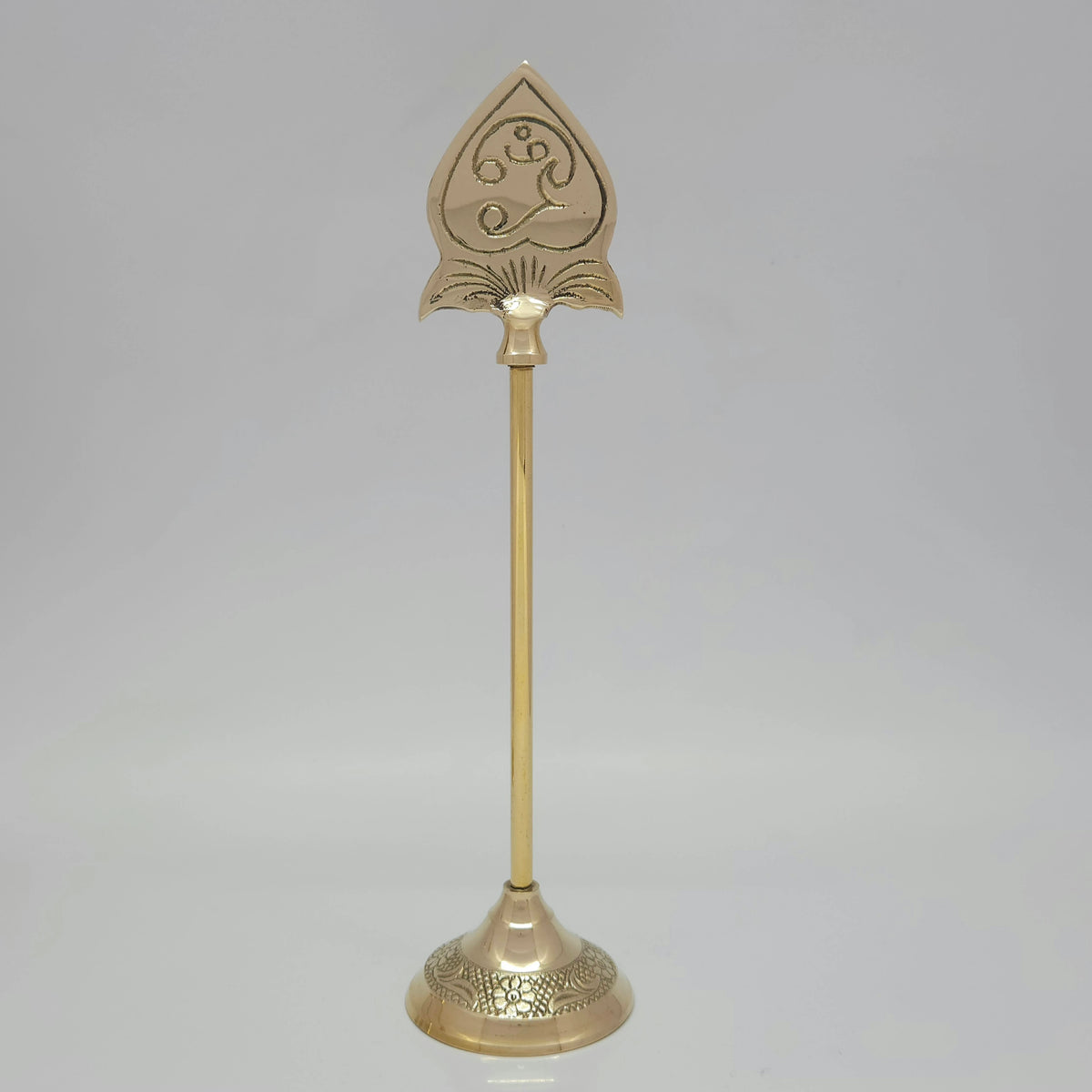 Full length portrait view of a tall pure brass Lord Murugan Vel stand highlighting the long central rod and structured leaf-shaped spear head.