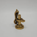 Three-quarter front right perspective view of the solid brass Nagalingam statue focusing on the side curvature of the five-headed serpent hood and the circular base.