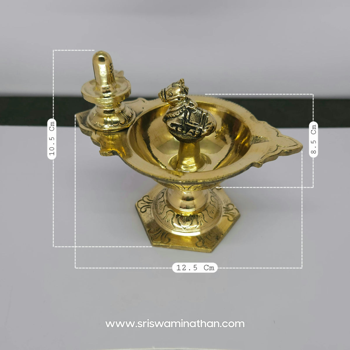 Front view layout diagram of pure brass Nandi Shiva Lingam stand diya showing a height of 10.5cm, length of 12.5cm, and lamp cup height of 8.5cm.
