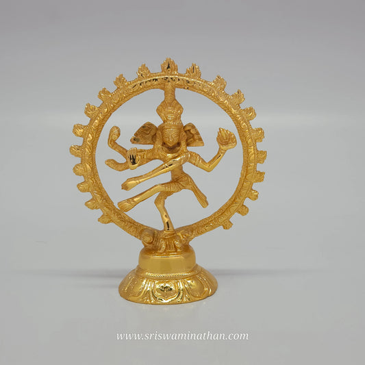 Direct front view of a pure brass Shiva Nataraja statue featuring a glossy gold layered coating, dancing inside a fiery circular halo
