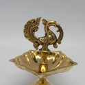 Close-up view showing the fine details of the handcrafted brass peacock and the 5-wick oil plate.