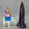 Side view showing the Ganesha on elephant piece completely pulled out next to the tall purple prabhavali frame.