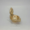 Side view of Amman vilakku showcasing Devi Shakti lamp design and brass work details