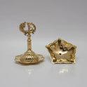 The brass peacock oil lamp unscrewed into two compact parts for travel or cleaning.