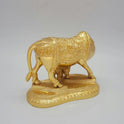 Right profile view of the heavy brass cow and calf statue showcasing the detailed Lord Ganesha engraving on the back side of the cloth carpet.
