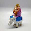 Turned view of the hand-painted resin Ganesha riding the white elephant standalone without the back archway base