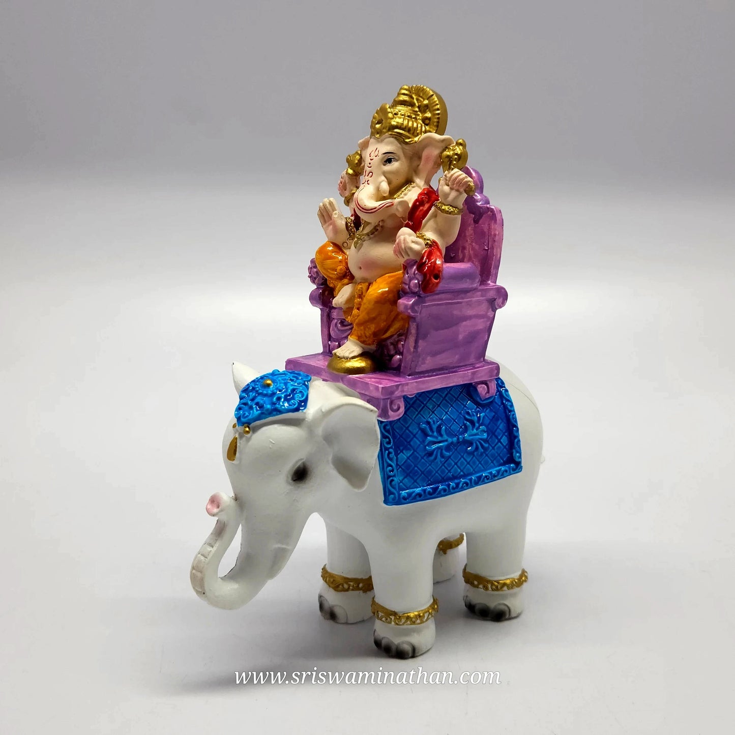 Turned view of the hand-painted resin Ganesha riding the white elephant standalone without the back archway base