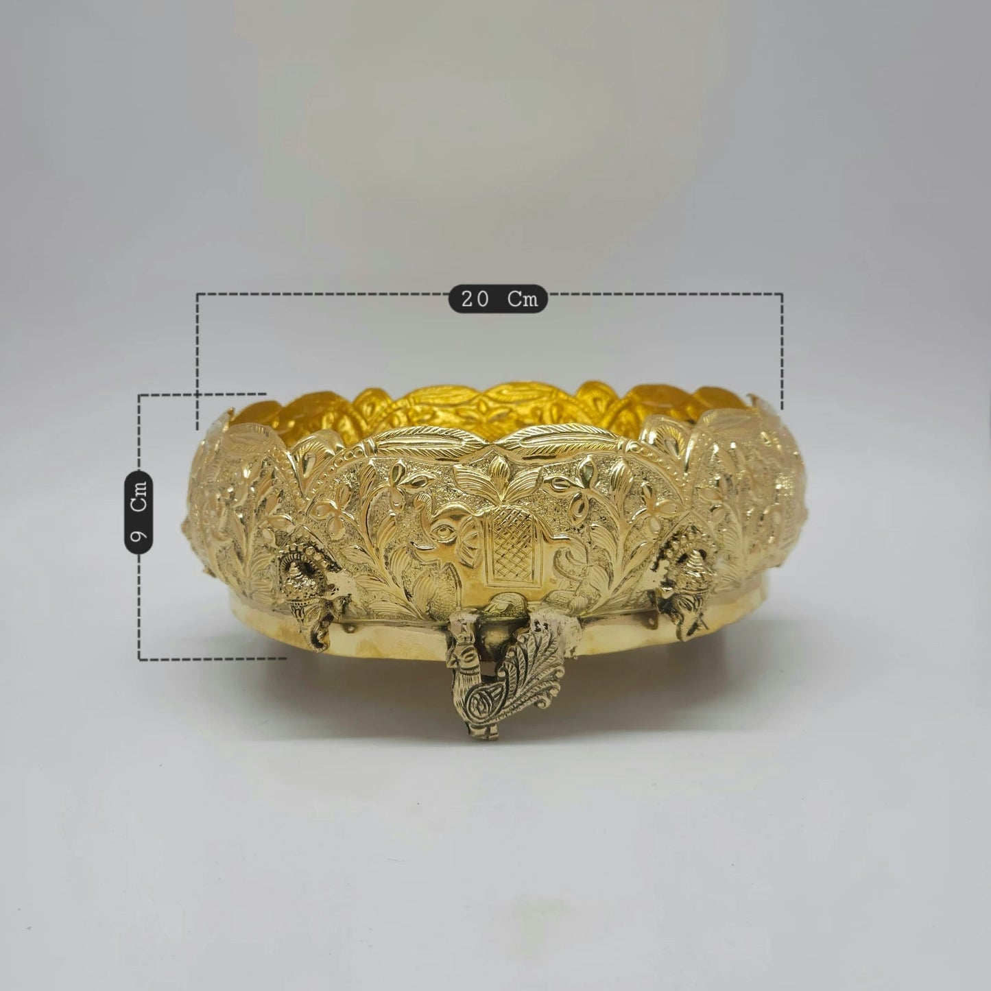Kumbakonam Brass 8 Inch Elephant Peacock Urli Bowl Angled Front Close Up Elephant Face Panel Floral Vine Peacock Leg Feet Detail Sri Swaminathan