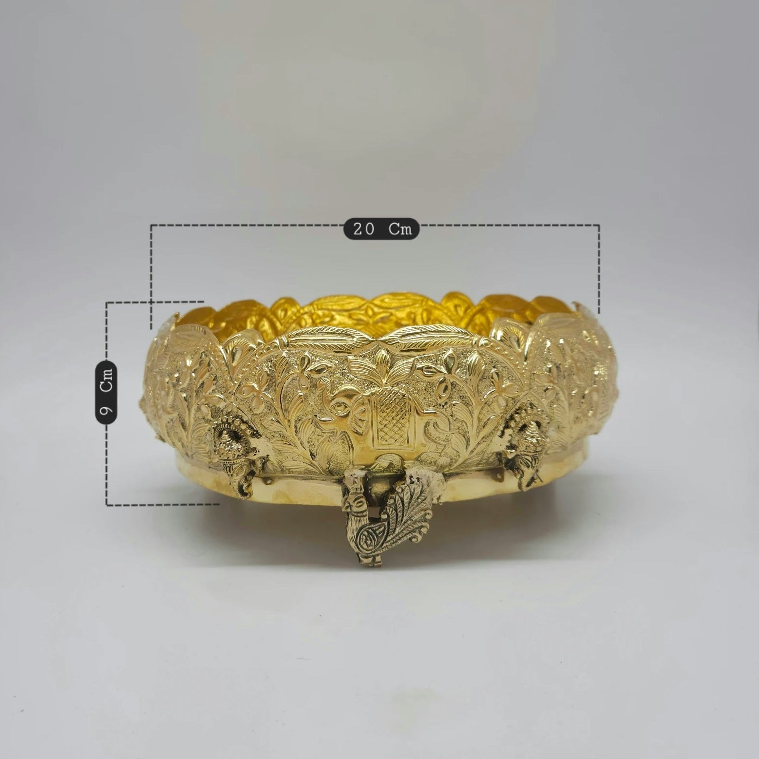 Kumbakonam Brass 8 Inch Elephant Peacock Urli Bowl Angled Front Close Up Elephant Face Panel Floral Vine Peacock Leg Feet Detail Sri Swaminathan
