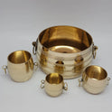 Slight high-angle view of the full pure brass chiri kinnam set highlighting the polished golden interiors of the four nested containers.
