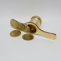 Close up macro shot of the precision machined bottom screw threads and tightening cap plate of the brass chakli maker.
