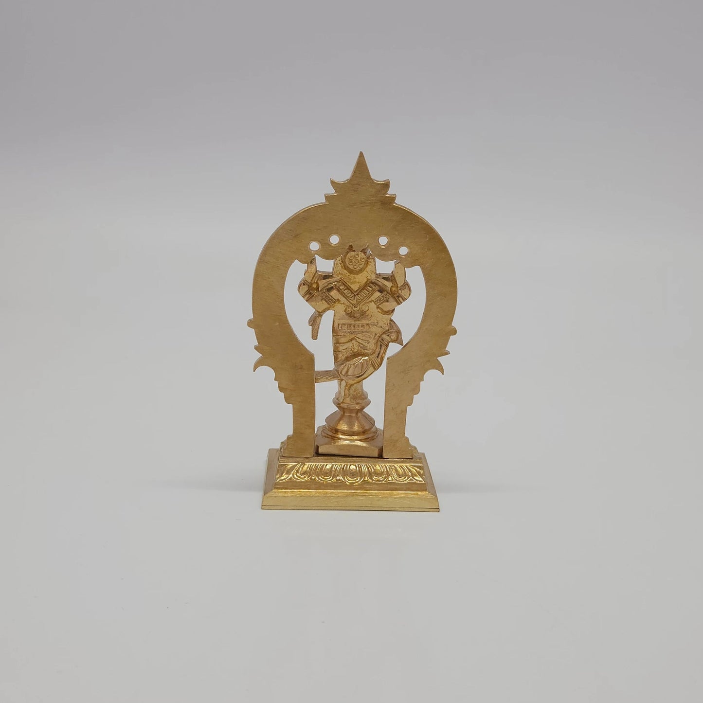 Rear view showcasing the solid back structure of the loop archway, the reverse pedestal lines, and the authentic raw brass texture of the 140g small idol.