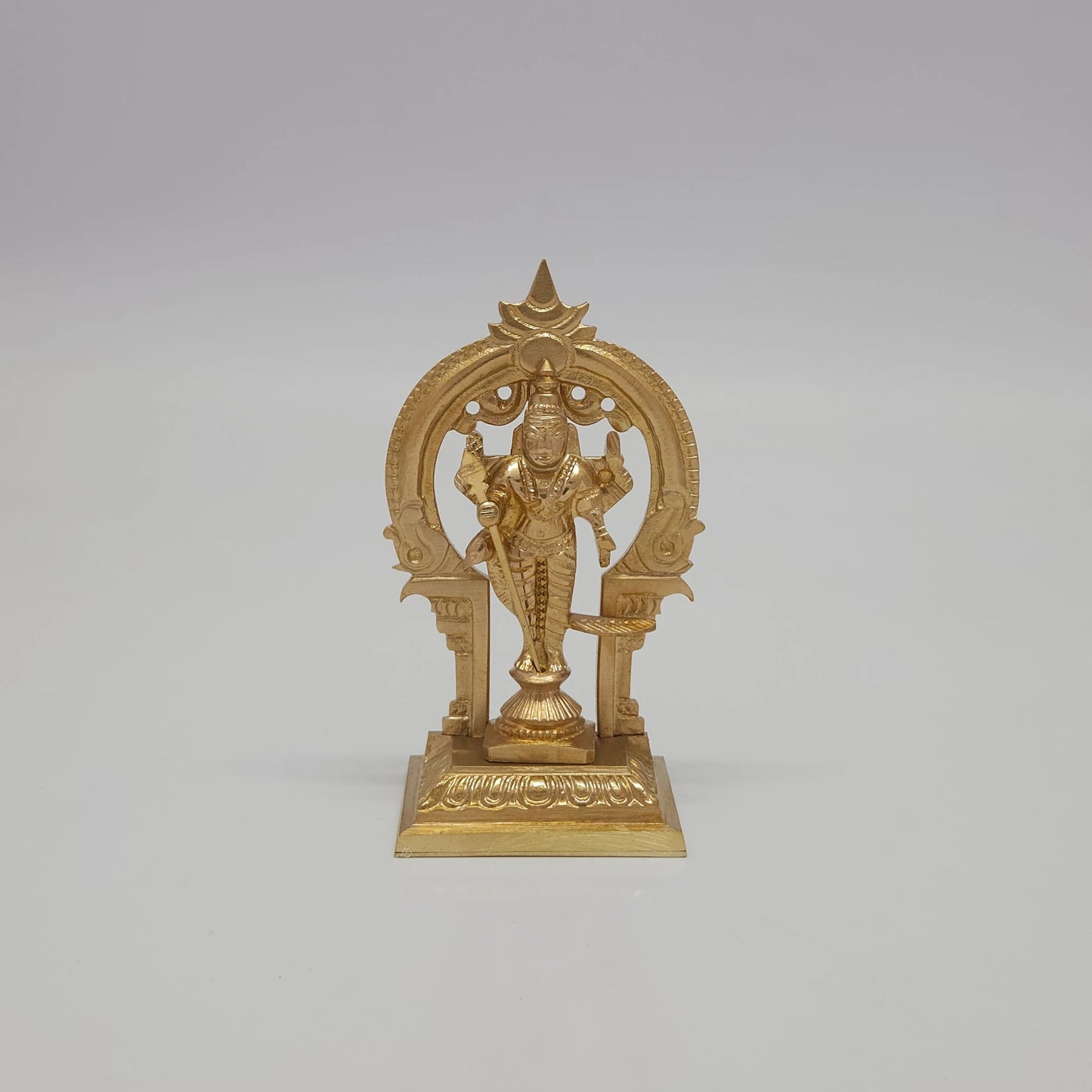 Front view of the 9.5cm handcrafted miniature solid brass Murugan statue with Vel and temple archway by Sri Swaminathan & Co for daily puja rituals.