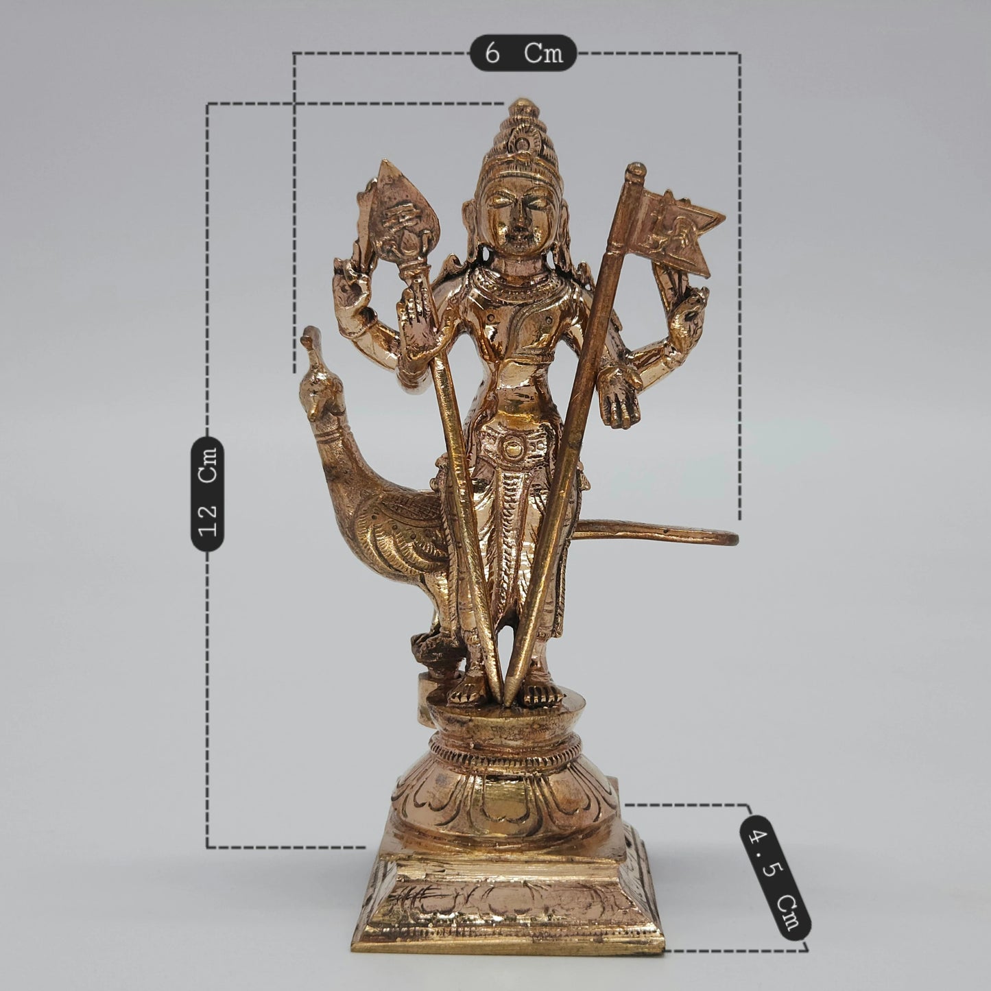 Sizing and dimension map diagram view of the 12cm height, 6cm length, and 4.5cm depth solid Panchaloha Murugan statue with Vel and Sevalkodi.