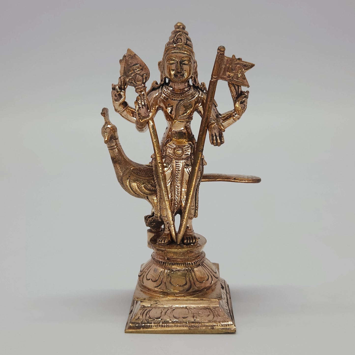 Front view of the 12cm premium handcrafted solid Panchaloha Murugan statue with Vel and rooster victory flag Sevalkodi on a lotus base for daily puja rituals.