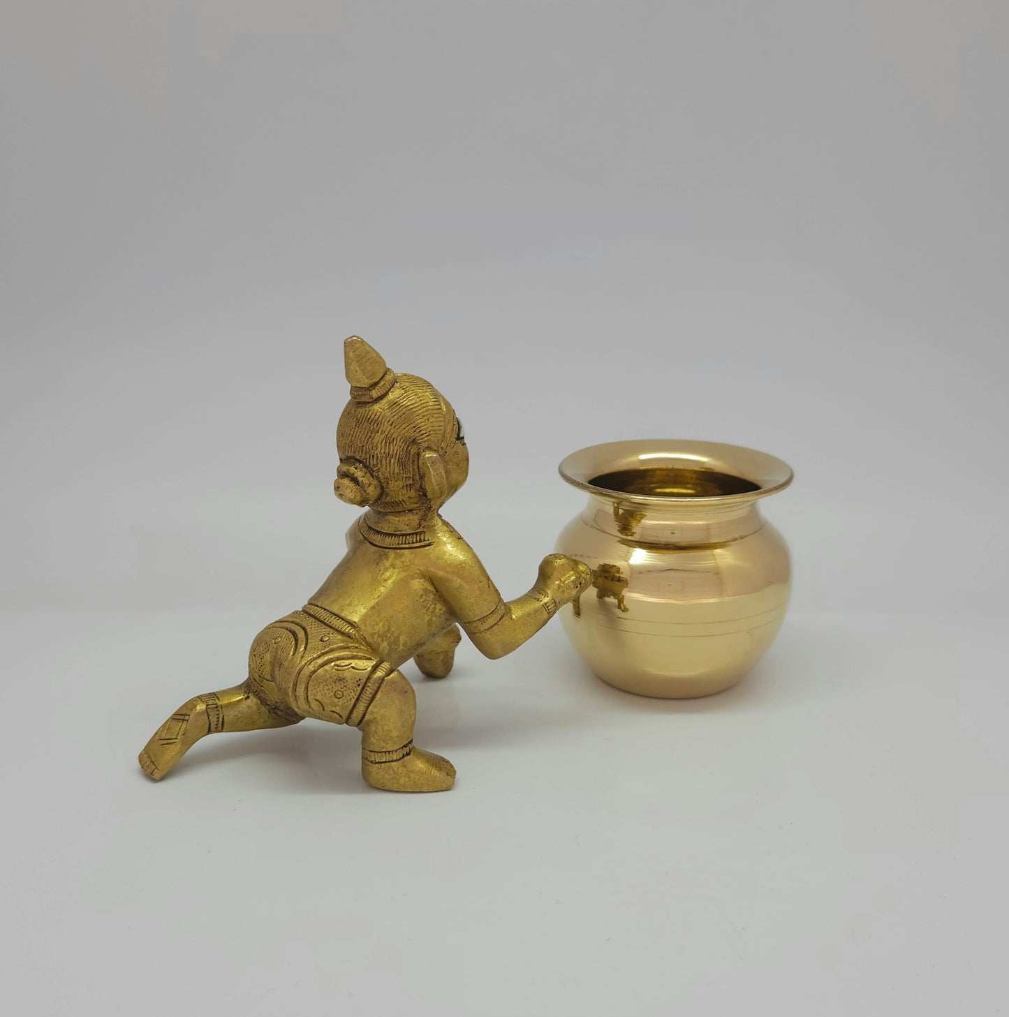 Rear-left 45-degree view of  Krishna side
layers, crawl-forward, and the flawless hand-polished antique luster.