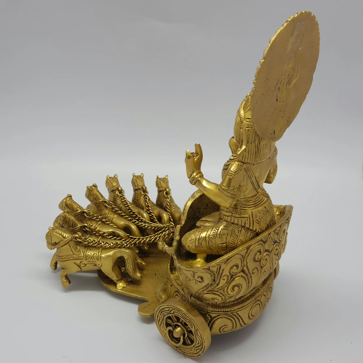 Rear-left 45-degree angle profile view emphasizing the back structure of the carriage box, horse alignments, and the thick functional wheel spoke carvings.