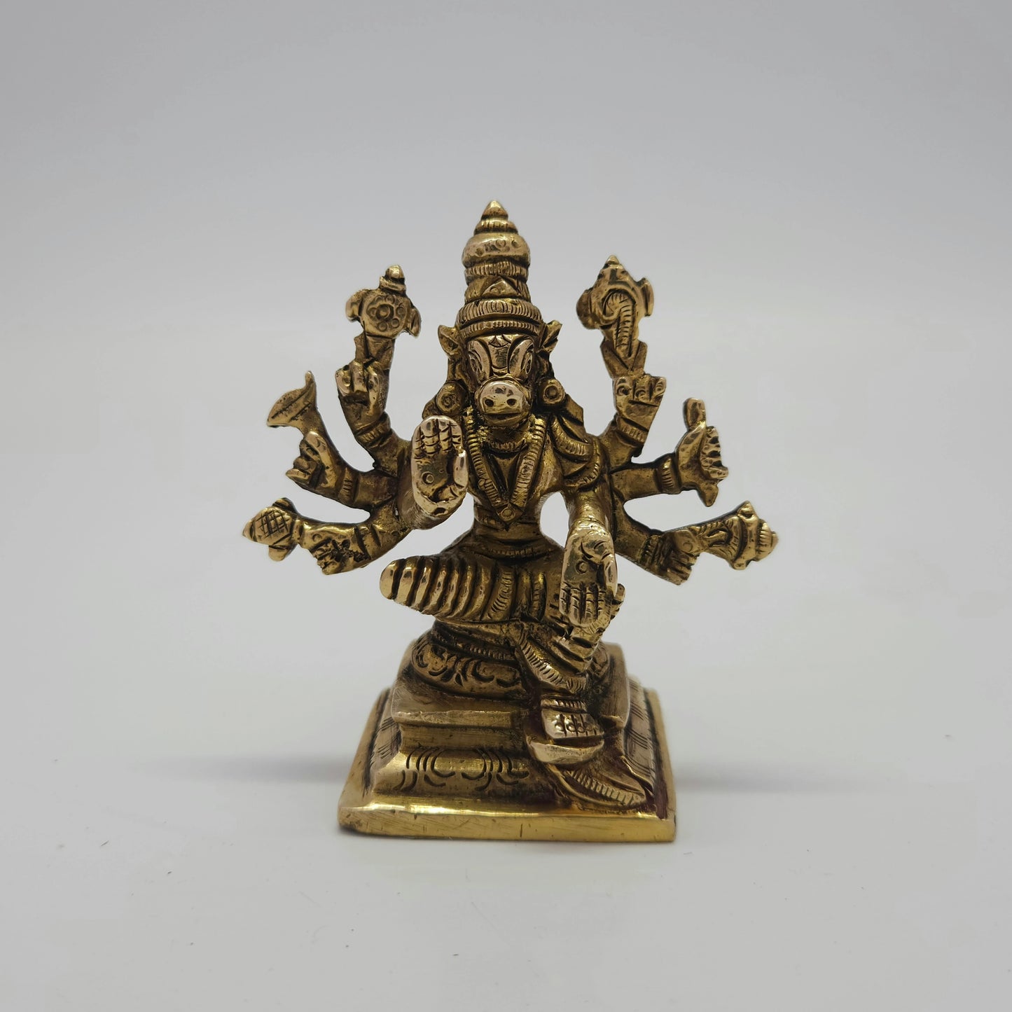 Flat straight front view of the 8cm small antique solid brass Varahi Amman statue on a square pedestal base for Tamil and Telugu puja rituals