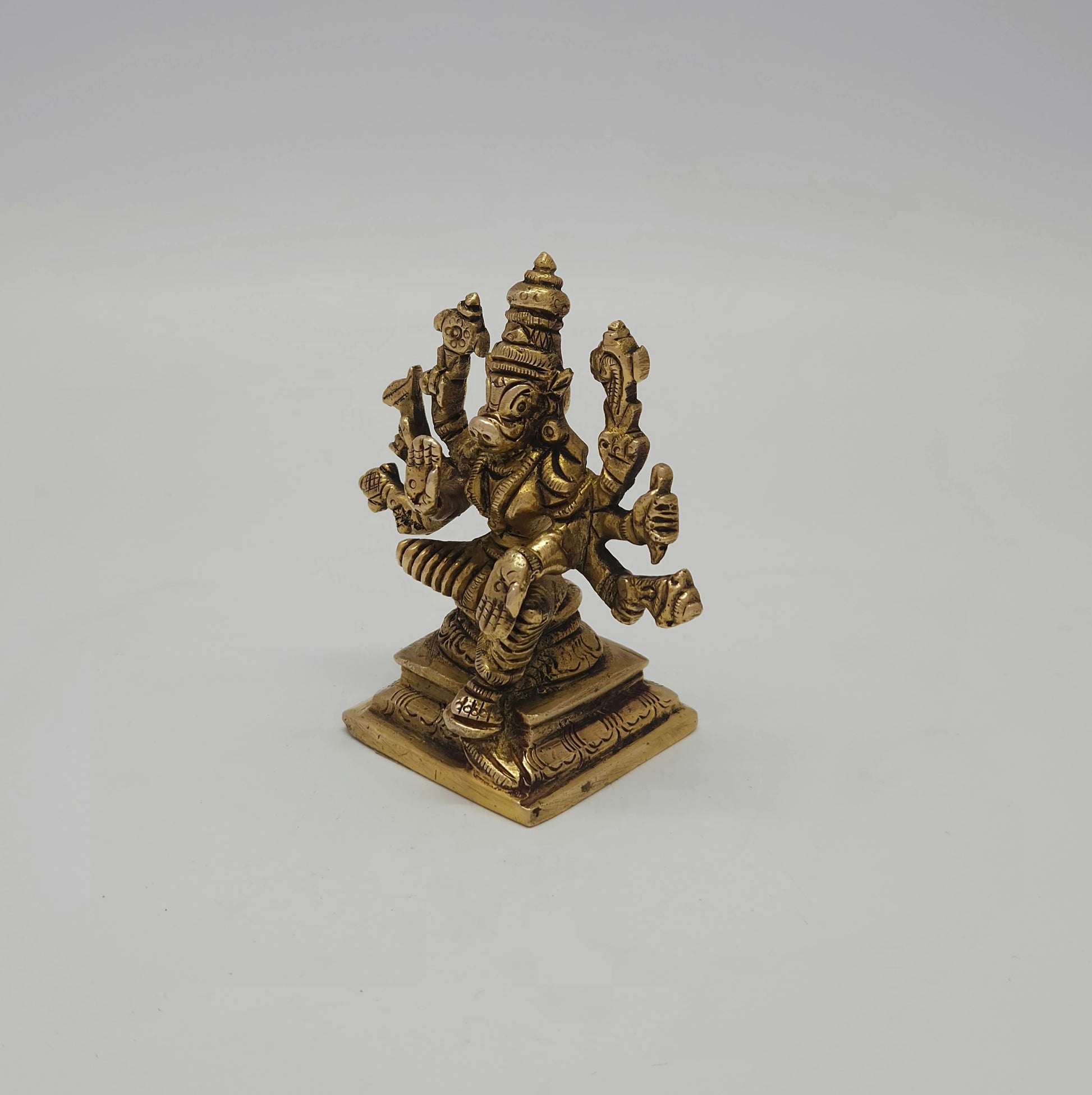 Left 45-degree angle profile emphasizing the pestle weapon details, Varahi's profile facial features, and the tiered square base borders.