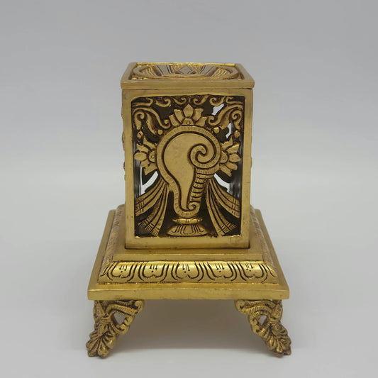 Flat straight front view of the 16cm modular antique solid brass Tirupati Balaji box set showing the detailed chiseled bas-relief carving of the sacred Conch