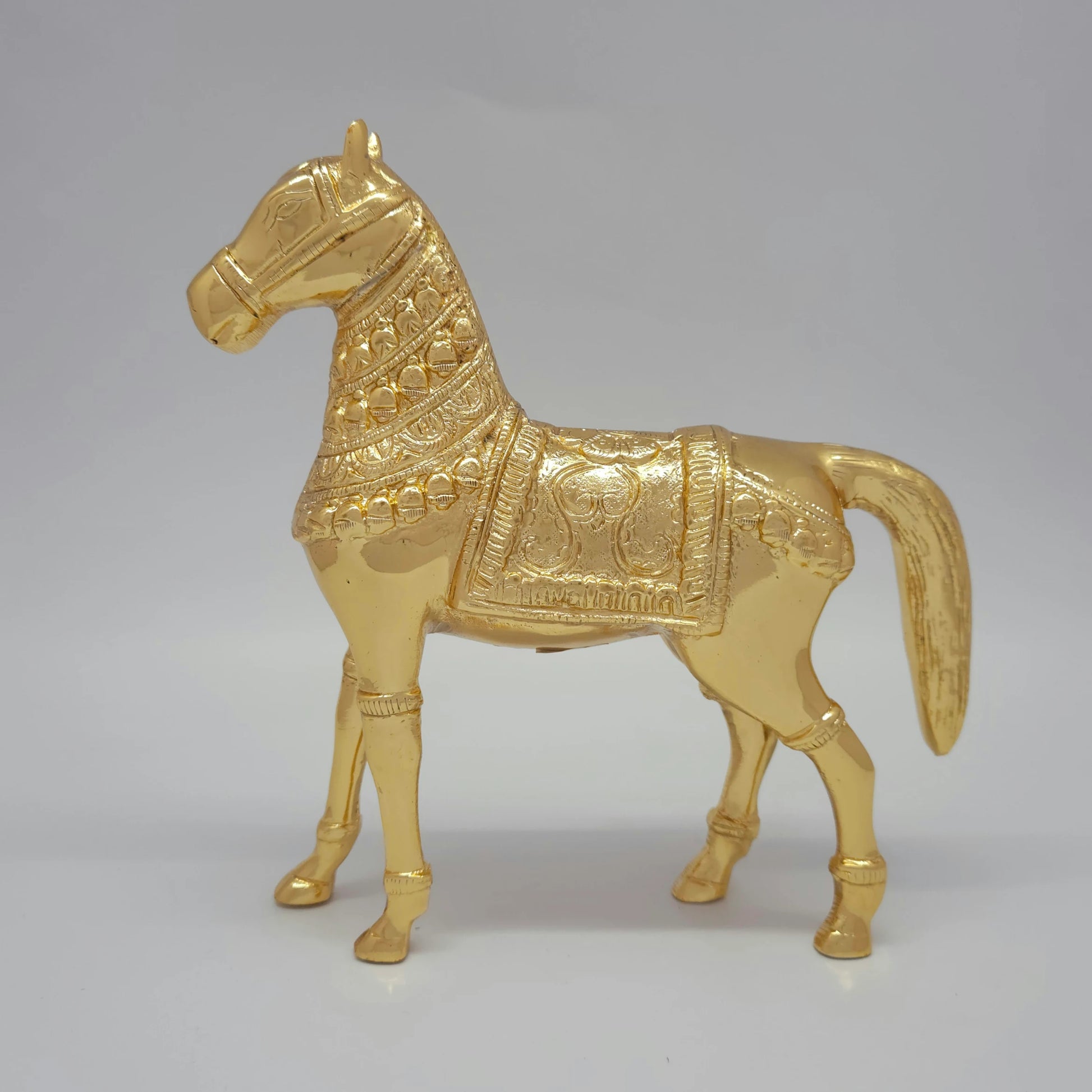 Flat left profile view of the 21.5cm premium high-gloss gold brass imperial horse sculpture showcasing full body saddlecloth detailing