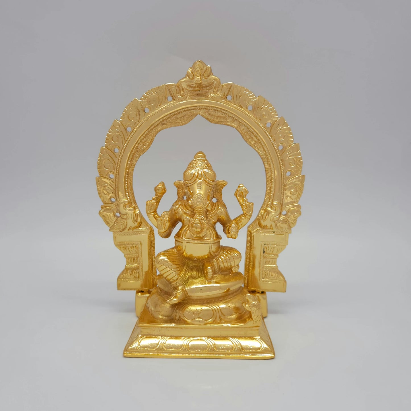 Front view of the 23.5cm premium high-gloss gold brass Vinayagar statue with detachable Tiruvatchi temple archway for luxury home decor