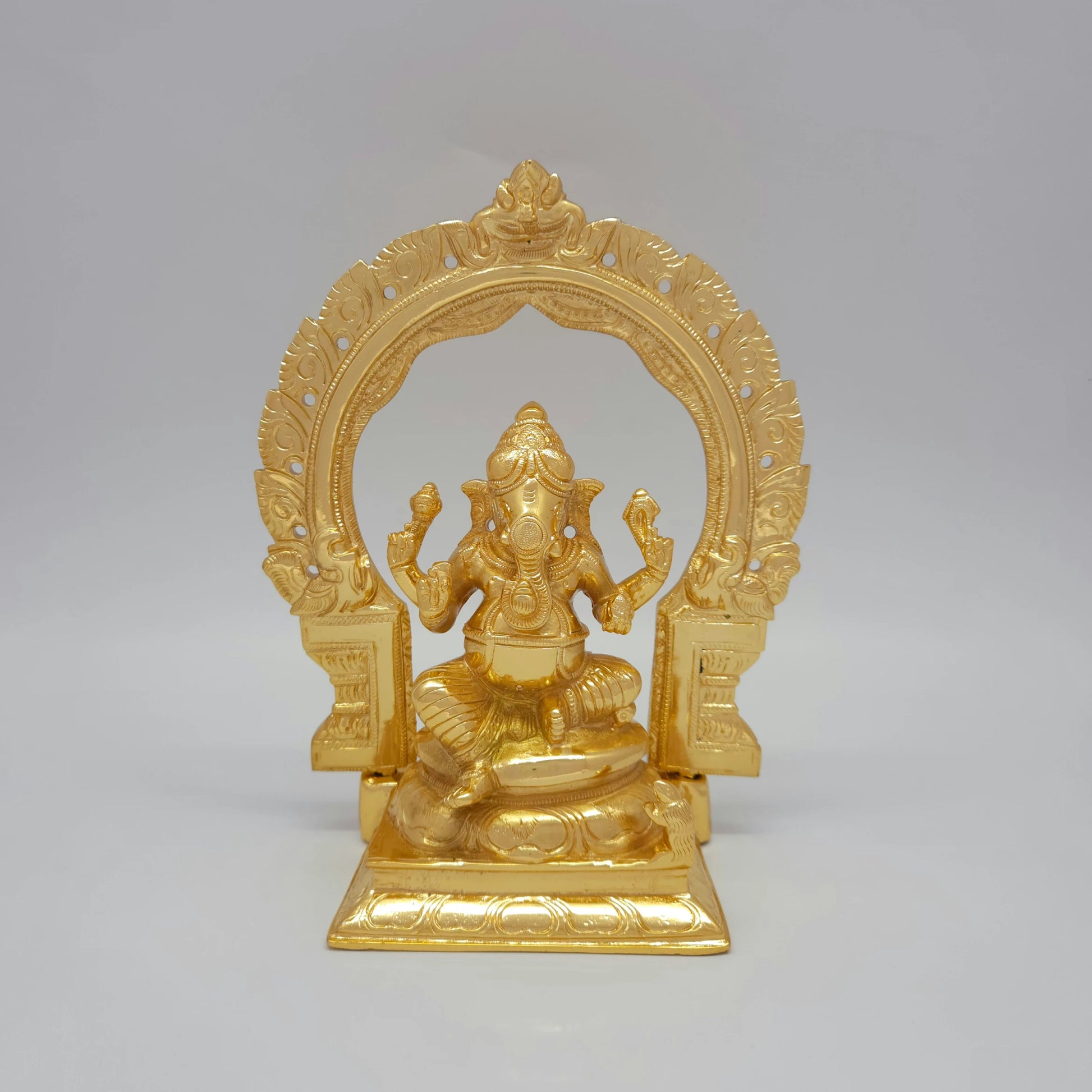 Front view of the 23.5cm premium high-gloss gold brass Vinayagar statue with detachable Tiruvatchi temple archway for luxury home decor
