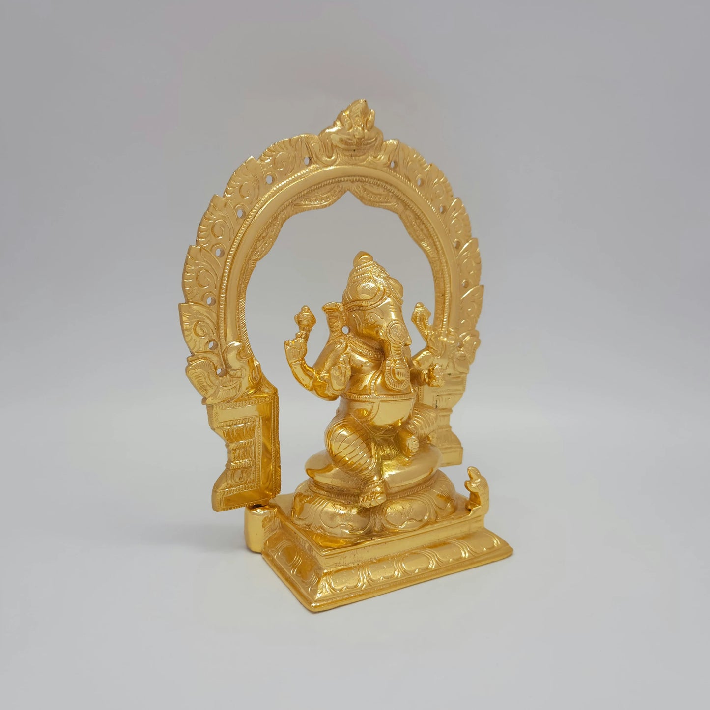 Right 45-degree close-up highlighting the trunk contour, the raised blessing hand, and the polished metal side contours.