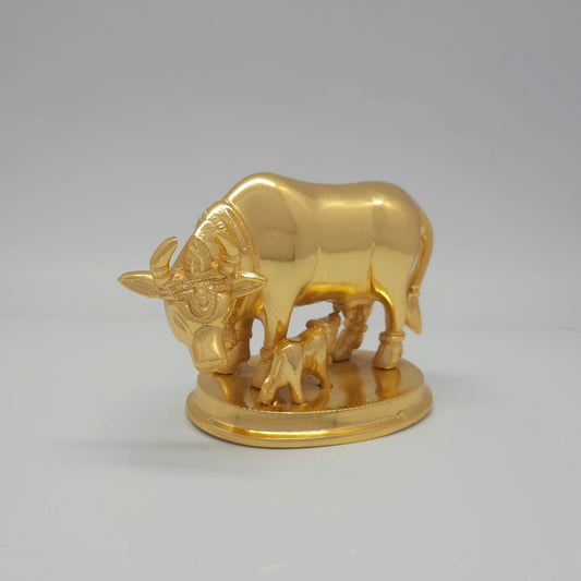 Front-right 45-degree angle profile view focusing on the serene cow facial lines, detailed forehead tilak ornamentation, and horns.