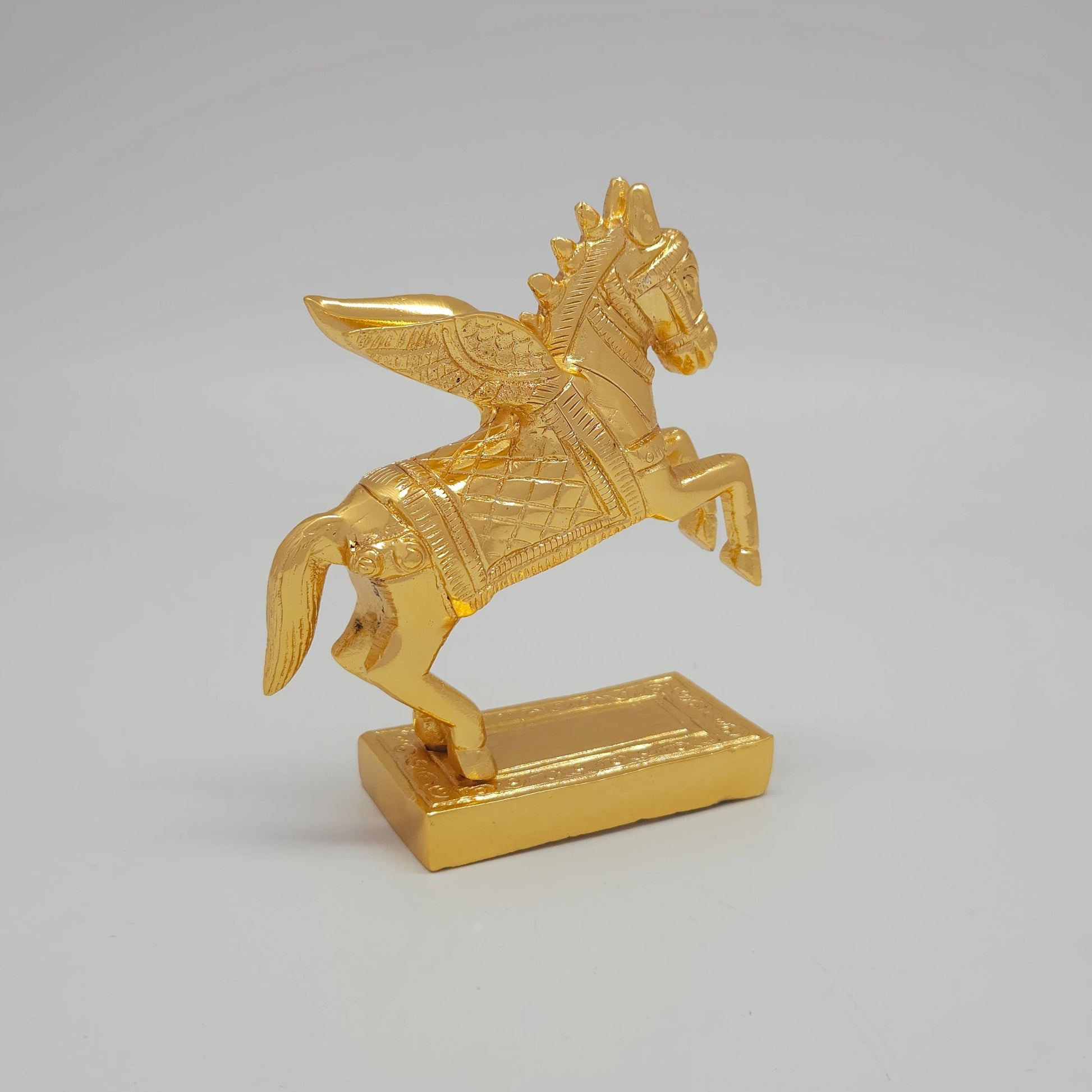 Side front view of the 11cm premium gold powder-coated solid brass Pegasus winged horse sculpture rearing atop a rectangular base.
